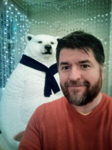 Photo of Christopher Ross with a Polar Bear (I'm the one on the right)